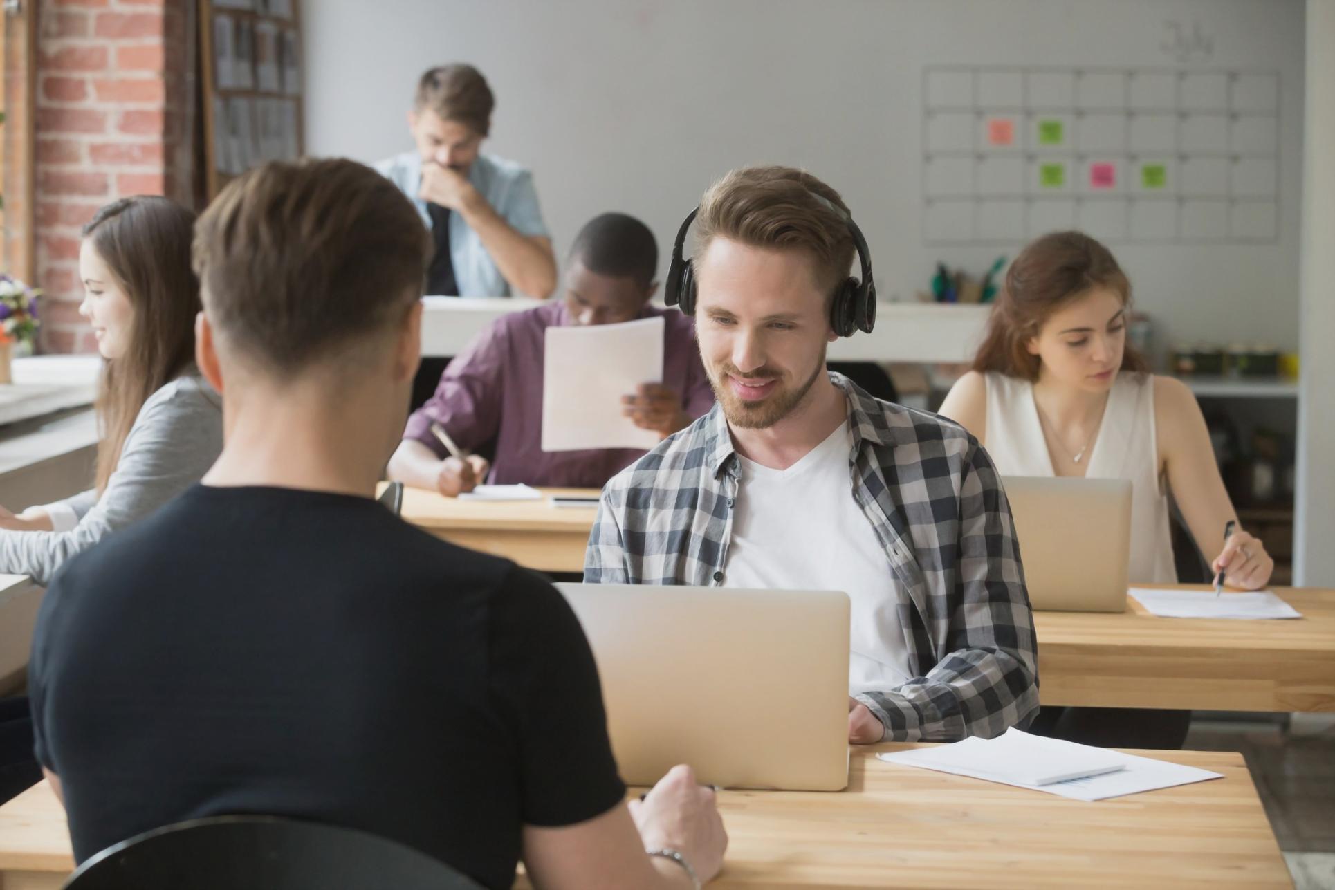 Instructor reviewing financial analysis with student during online session